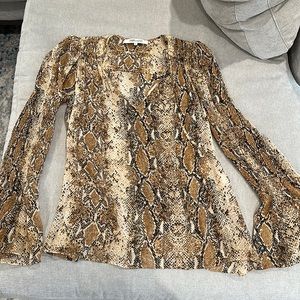 Diane Von Furstenberg silk animal print blouse.